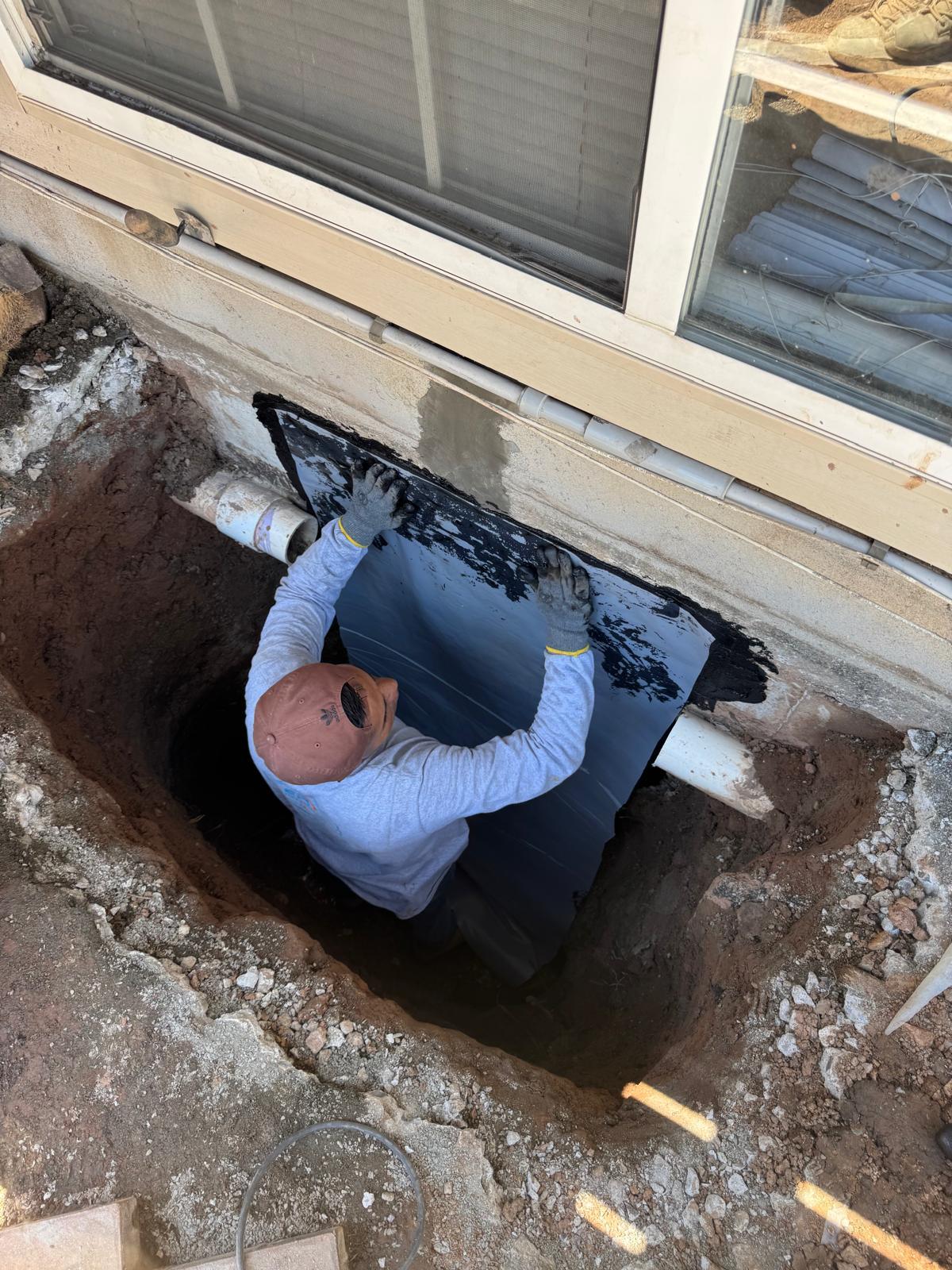 Foundation waterproofing work in progress