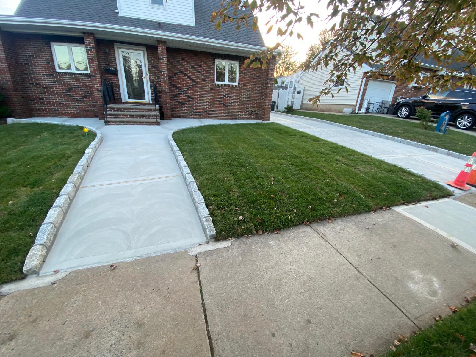 Front sidewalk and lawn edge after concrete work